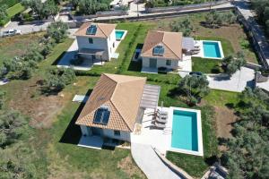 an aerial view of a house with a swimming pool at Anagallis Villas in Lefkada