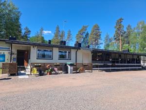 a building with a lot of windows on it at Schools Out OY in Loviisa