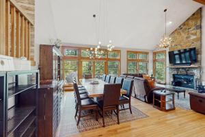 a kitchen and living room with a table and a couch at Vista at Camelback Mountain in Tannersville