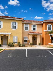 a house with a parking lot in front of it at See you in Orlando in Kissimmee