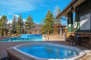 a large tub of water in front of a building at Restful Rockies Overlook in Steamboat Springs