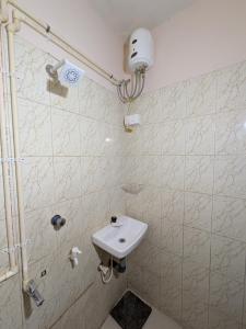 a bathroom with a sink and a shower at JUST WALKING DISTANCE FROM Temble in Guruvāyūr
