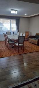 a dining room with a table and chairs at Barabás Guest House in Brădeşti