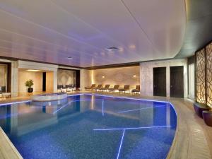 a large swimming pool in a hotel room at Sofitel Riyadh Hotel & Convention Centre in Riyadh