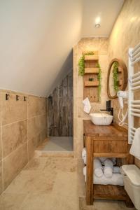 a bathroom with a sink and a shower at EnergyZen - Spa Alsace - le Refuge des Anges in Bischoffsheim