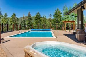 a swimming pool in the middle of a yard at Alpenglow Bungalow in Steamboat Springs