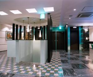 a lobby with a checkered floor and black doors at Hotel Venus Ritz (Adult Only) in Seto