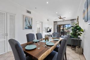 a dining room with a wooden table and chairs at Oceanview Condo Across From Beach with Resort Pool in Tamarindo