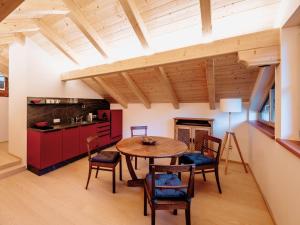 a kitchen and dining room with a table and chairs at Landlust Ischl in Bad Ischl
