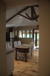 a kitchen and dining room with a table and chairs at Domaine de Calabel in Pouylebon