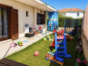 a childs play area with a playground with a ladder and toys at CASA Di TRE MARE in Nea Kallikrateia