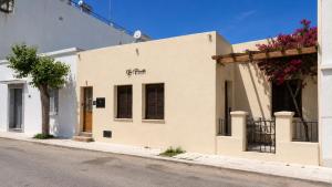 a building on the side of a street at 9-4 Private Houses in Kos +46 photos