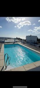 a swimming pool on top of a building at Seaside View Terrace Apartment in Mauritius