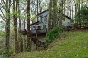 a house on top of a hill in the woods at Eagle Point - Powder Horn Mountain in Powderhorn Mountain