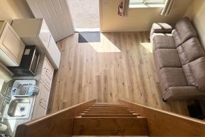 an overhead view of a living room with wood floors at Old Faithful RV Park LLC in Cody +25 photos
