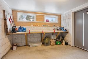 a kitchen with a counter and a sink in a room at Flott hytte på Bjørgan in Grong +13 photos