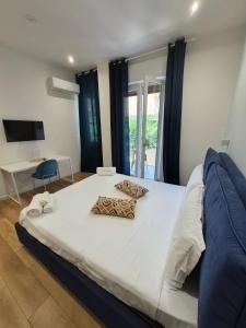 a bed with two pillows on it in a bedroom at B&B Magnolie in Palermo