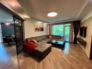 a living room with a couch and a table at La Zur Guest House in Ravda