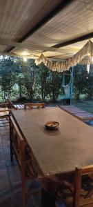 a wooden table with a bowl on top of it at La Elvira in San Pedro