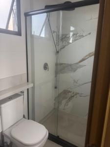 a bathroom with a shower and a toilet at Apartamento del sole in Vitória +40 photos