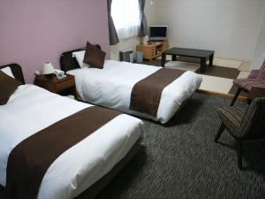 Postel nebo postele na pokoji v ubytování Resort Inn North Country + 42 fotografií