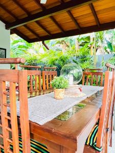 a wooden table with a glass bowl on top of it at Onadi House in Galle
