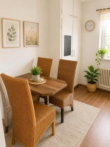 a dining room with a wooden table and chairs at Apartmenthaus in der Nähe Wolfsburg und VW in Oebisfelde