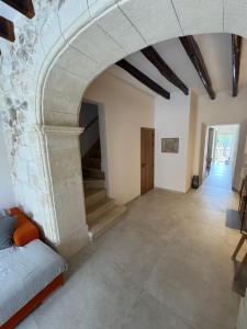 a large room with an archway in a building at Campet50 in Felanitx