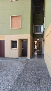 an empty parking lot in front of a building at Tiny House in Quarto dʼAltino