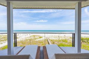 a living room with a view of the ocean at Seaview Serenity - Team Joseph Ellen in Jacksonville Beach