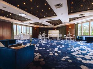 a ballroom with chairs and tables in a room at Sofitel Gold Coast Broadbeach in Gold Coast +197 photos