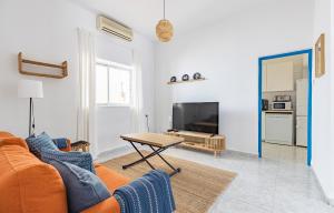 a living room with a couch and a table at Casa Marina - Desayuno y parking incluidos in Portman