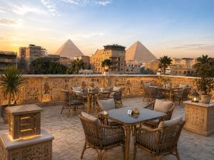 a restaurant with a view of the pyramids at Giza Pyramids view hotel in Giza