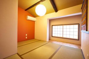 a room with an empty room with a window at Kyoyado Hakuto in Kyoto