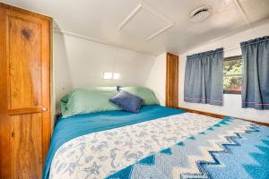 a bedroom with a bed in a small room at Pool & Dock Access! Badin Lake Resort Gem in New London +29 photos
