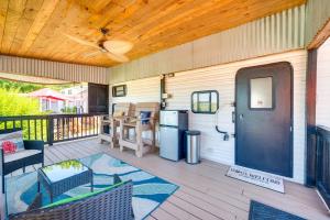 a patio with a refrigerator and a table and chairs at Pool & Dock Access! Badin Lake Resort Gem in New London