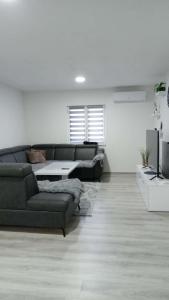 a living room with a couch and a table at Villa EMELA in Jajce