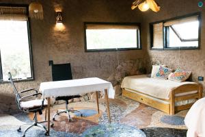 a room with a bed and a desk in a room at Casa Nativa in Mendoza