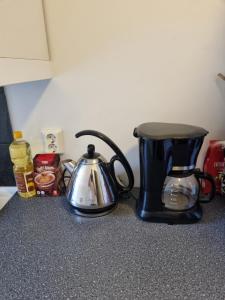 a coffee maker and a tea kettle on a counter at Nice appartment in city center Gol,free Wifi and electric in Gol