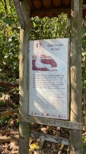 a sign for a garden do naya on a tree at Casa Recanto in Angra dos Reis +47 photos