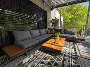 a living room with a couch and a table at Apartmán Smraďavka in Buchlovice +24 photos
