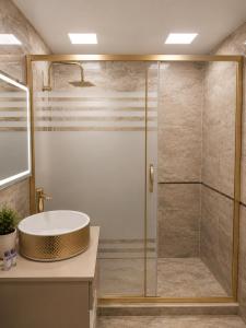 a bathroom with a shower and a sink at Central City Department Hotel in Baku +18 photos