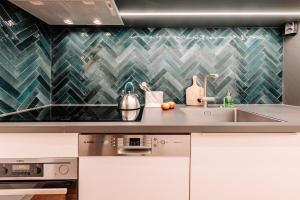 a kitchen with a sink and a counter top at Komfortable Familienwohnung in Moosham
