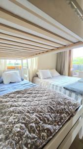 two beds sitting next to each other in a bedroom at Tatrzańska Prowansja SPA&SKI Apartamenty in Zakopane +102 photos