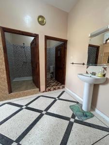 a bathroom with a sink and a mirror at Sunlight guest house in Taghazout +179 photos