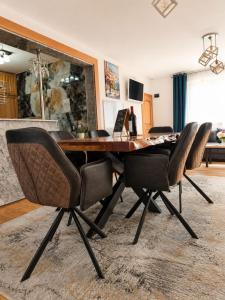 a dining room table with chairs and a desk at Villa Sea La Vie in Utjeha +56 photos