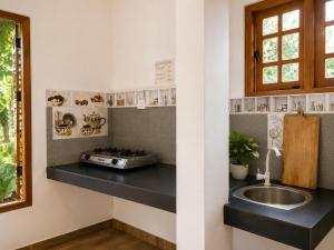 a kitchen with a sink and a counter top at Haputala Blossom guest in Haputale