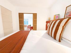 a bedroom with a bed and a table at Le Chabeuillois in Chabeuil