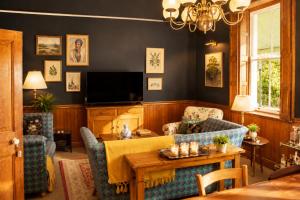 a living room with a couch and a table at Albert Manor guest house in Ladismith