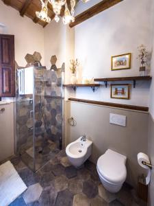 a bathroom with a toilet and a shower at Palazzo Ravenna in Ravenna +26 photos